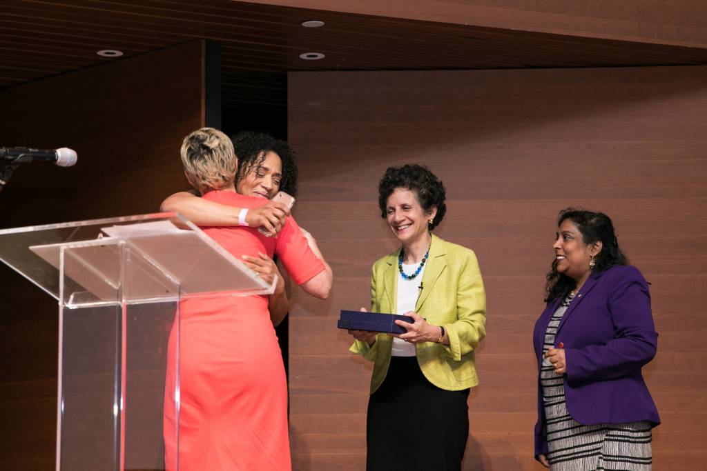 Kathryn O'Neal-Dunham hugs Jennifer Jones Austin (award winner)