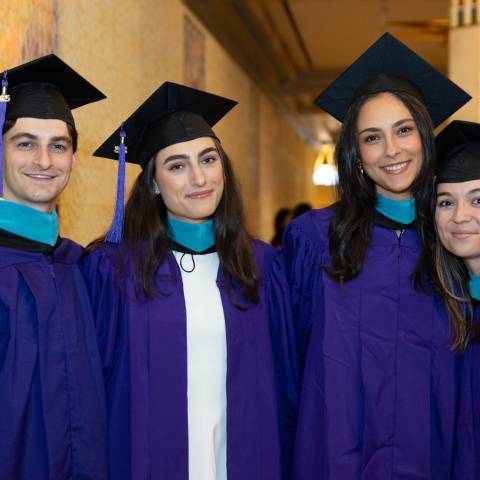 graduates smiling for camera