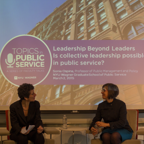 Dean Sherry Glied in conversation with another person on stage