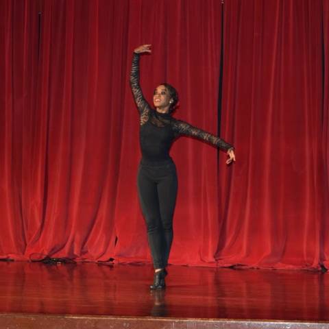 Woman dancing in ballet-like pose