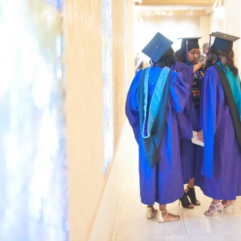People getting ready for graduation