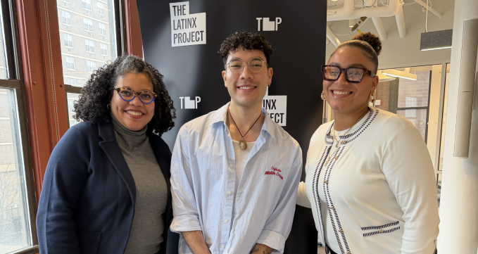 Photo of David Salinas with two women in front of a black background with The Latinx Project's logo. One of the women is Wagner professor Judy Pryor-Ramirez.