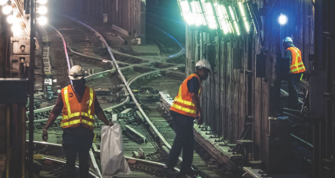 Subway workers in a tunnel